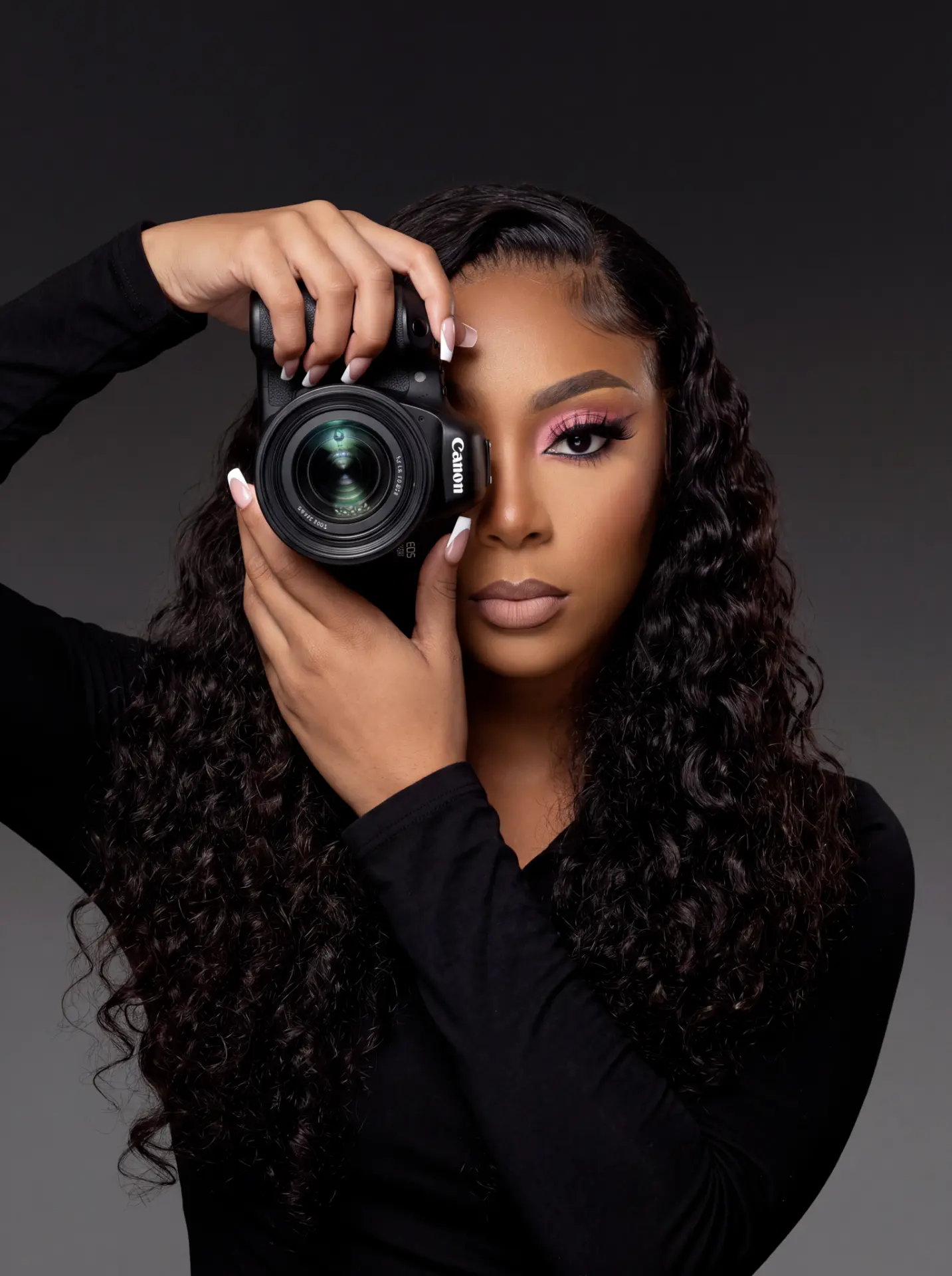 Danielle Hanna, Founder of Spark Media Bahamas, behind the camera