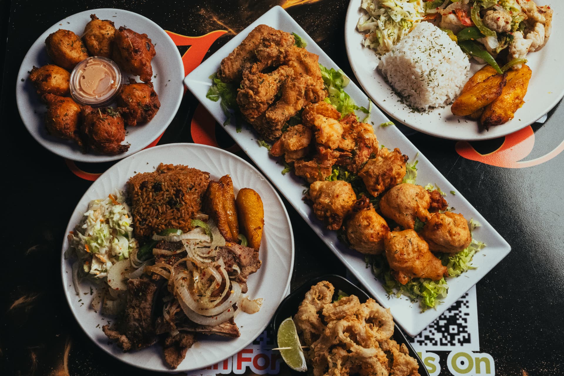 Overhead spread of Bahamian dishes at Joey's Restaurant