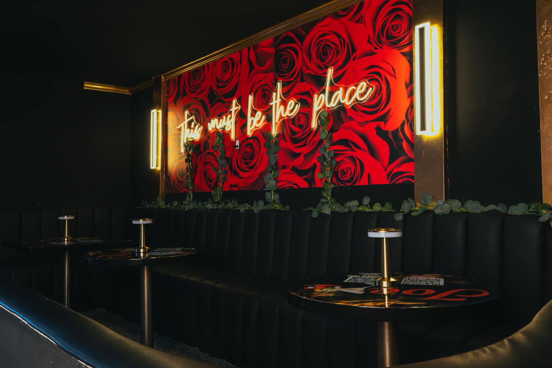 Joey's Restaurant interior with neon sign and rose wall